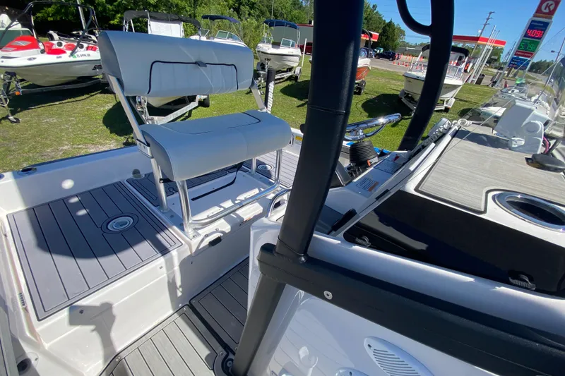 Slide: The Image of 2023 Yamaha Boats 195 FSH Sport interior with seating and control panel. - 6