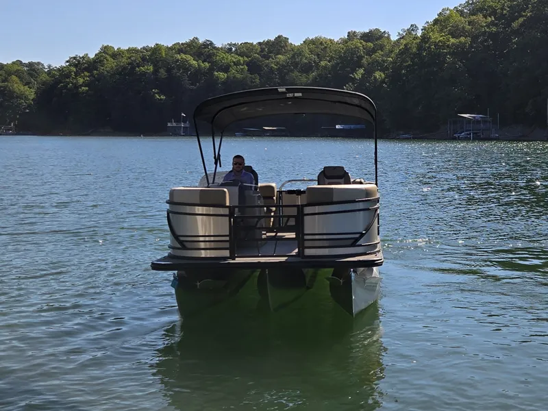 Slide: The Image of Starcraft EXS 1 R 2026 on a calm lake with a wooded shoreline in the background. - 2
