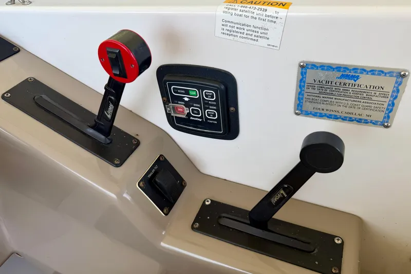 Slide: The Image of 2004 Four Winns 280 Horizon boat controls and yacht certification plaque. - 16