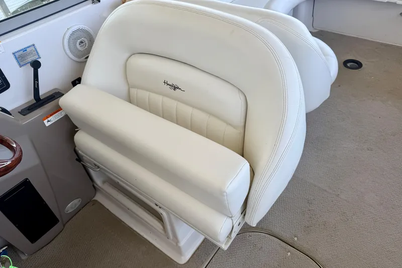 Slide: The Image of White leather seat on 2004 Four Winns 280 Horizon boat interior. - 19