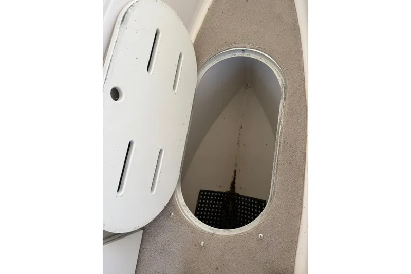 Slide: The Image of Open storage compartment on 2004 Four Winns 280 Horizon boat. - 24