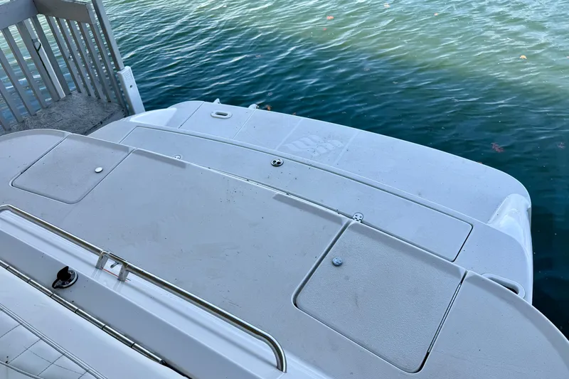 Slide: The Image of 2004 Four Winns 280 Horizon boat deck by the water. - 27