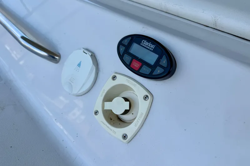 Slide: The Image of 2004 Four Winns 280 Horizon boat control panel with Clarion audio system. - 28