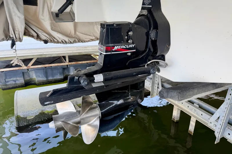 Slide: The Image of Mercury outboard motor on 2004 Four Winns 280 Horizon boat, docked on a lift. - 32