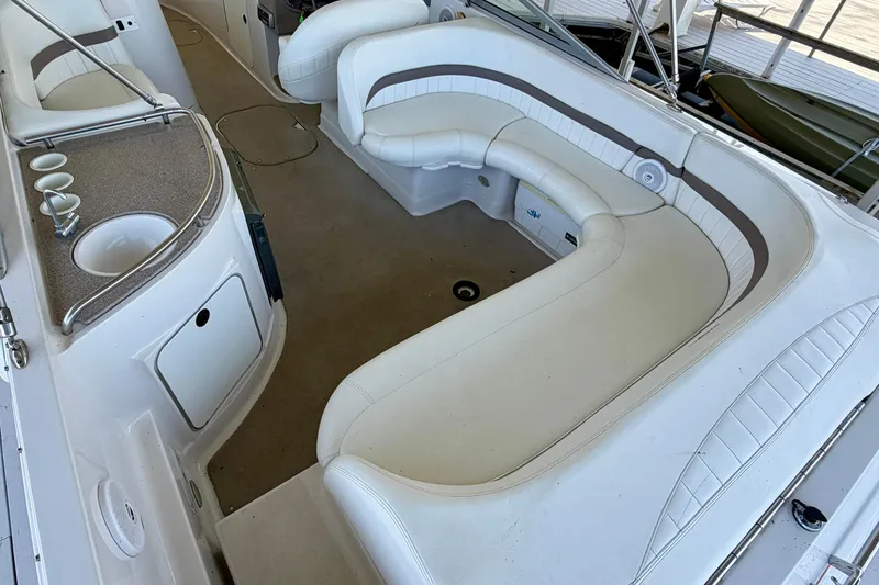 Slide: The Image of 2004 Four Winns 280 Horizon boat interior with seating and kitchenette area. - 6