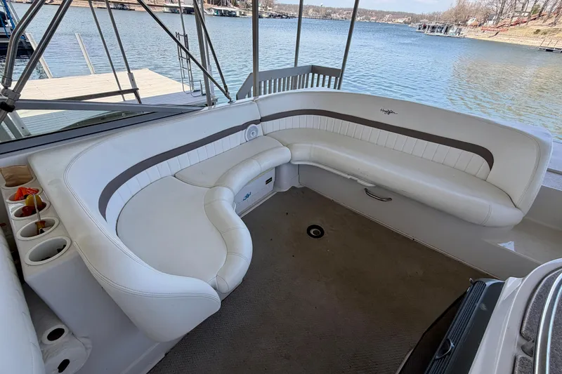 Slide: The Image of 2004 Four Winns 280 Horizon boat interior with white seating and lake view. - 7