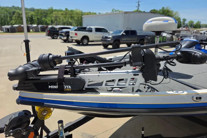 Slide: The Image of 2017 Ranger Z521 Comanche boat with Minn Kota Ultrex trolling motor in a parking lot. - 3