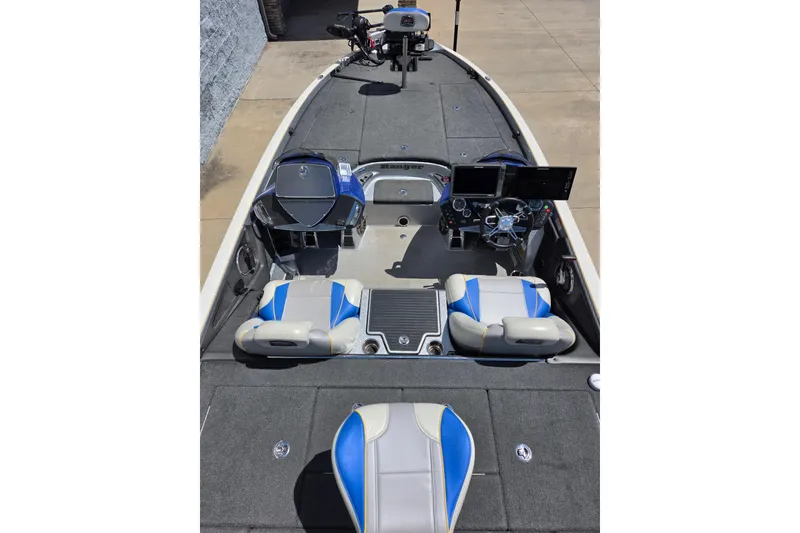 Slide: The Image of 2017 Ranger Z521 Comanche boat interior with blue and white seating and advanced dashboard controls. - 6