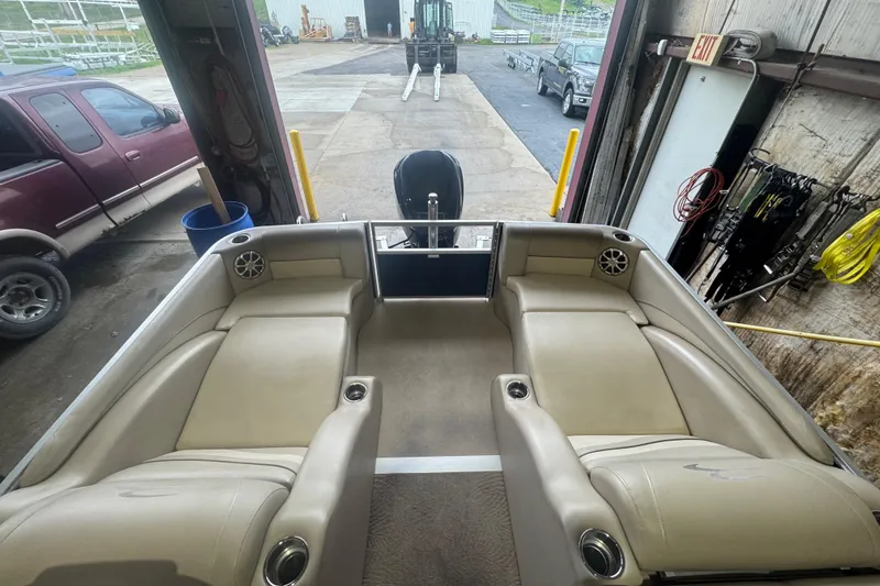 Slide: The Image of Interior view of a 2010 Bennington 2550RCW pontoon boat in a garage. - 22
