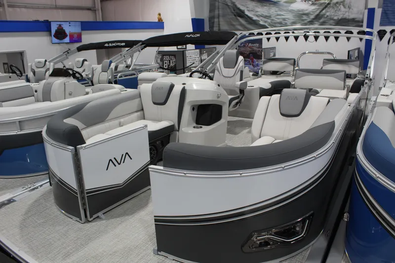 The Image of 2026 Avalon 2385 25 LSZ QLS pontoon boat displayed at a boat show. - 0
