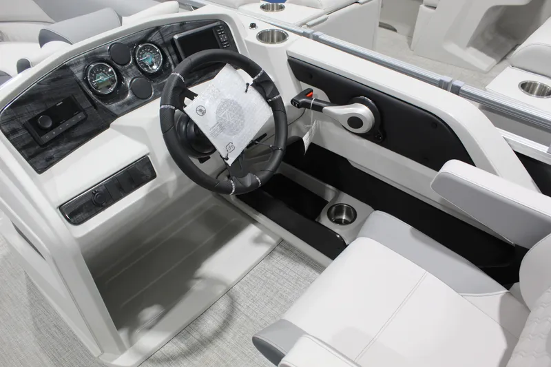 Slide: The Image of Interior of 2026 Avalon 2385 25 LSZ QLS boat, featuring modern steering console. - 3