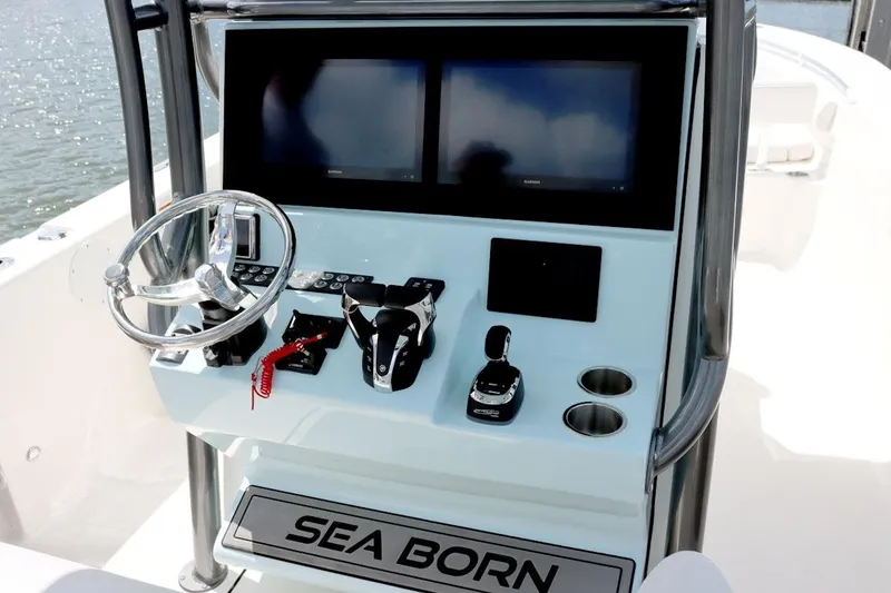 Slide: The Image of Manufacturer Provided Image: 2025 Sea Born LX26 Center Console boat dashboard with dual screens and steering wheel. - 3