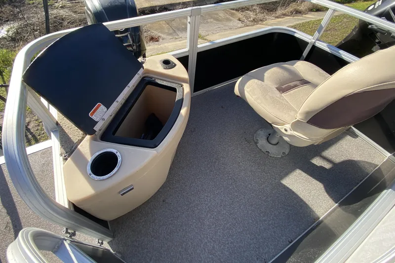 Slide: The Image of 2018 Sun Tracker Bass Buggy 18 DLX boat interior with seat and storage compartment. - 12