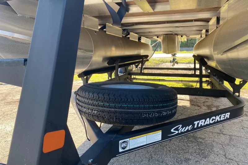 Slide: The Image of Underneath view of a 2018 Sun Tracker Bass Buggy 18 DLX pontoon boat on a trailer. - 14