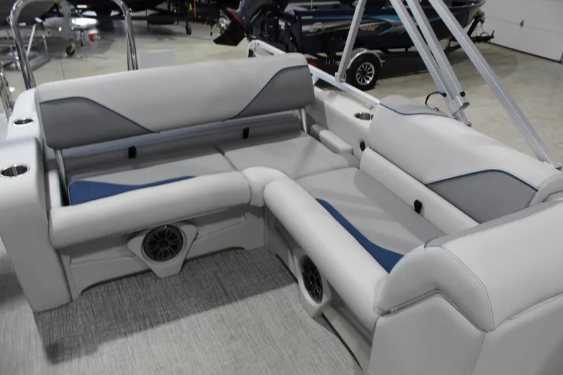 Slide: The Image of 2026 Avalon 2385 25 Venture 85 VRB boat interior with gray seating and speaker system. - 5
