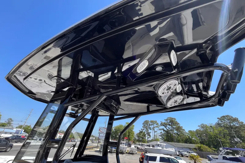 Slide: The Image of Tidewater 282 CC Adventure 2026 boat's sleek black T-top with integrated speakers and lights. - 10