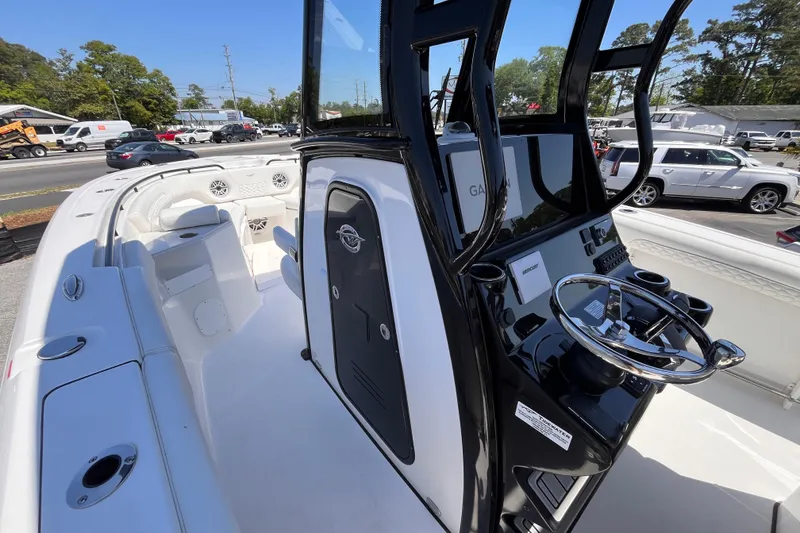 Slide: The Image of 2026 Tidewater 282 CC Adventure boat interior with sleek console and seating. - 11