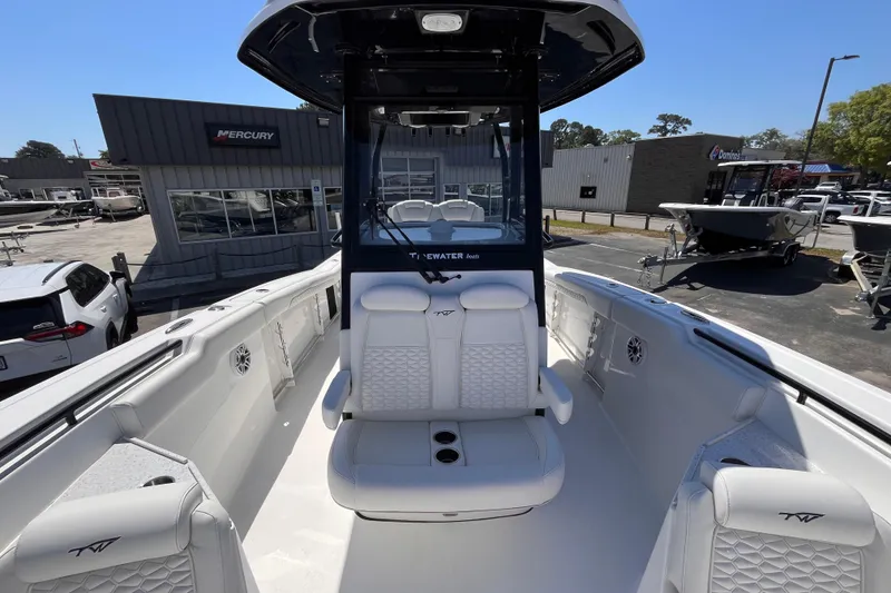 Slide: The Image of 2026 Tidewater 282 CC Adventure boat interior with white seating and modern design. - 13