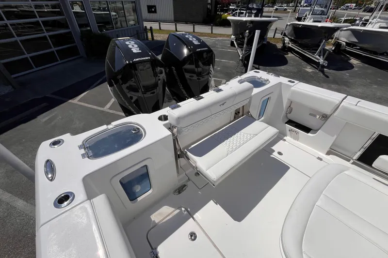 Slide: The Image of 2026 Tidewater 282 CC Adventure boat with dual Mercury engines and spacious seating. - 17