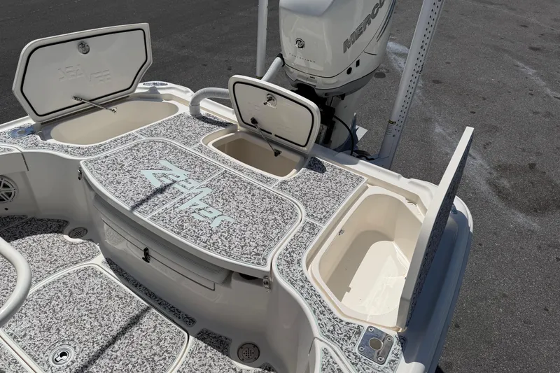Slide: The Image of 2019 Sea Vee 270Z boat deck with storage compartments and Mercury engine. - 10