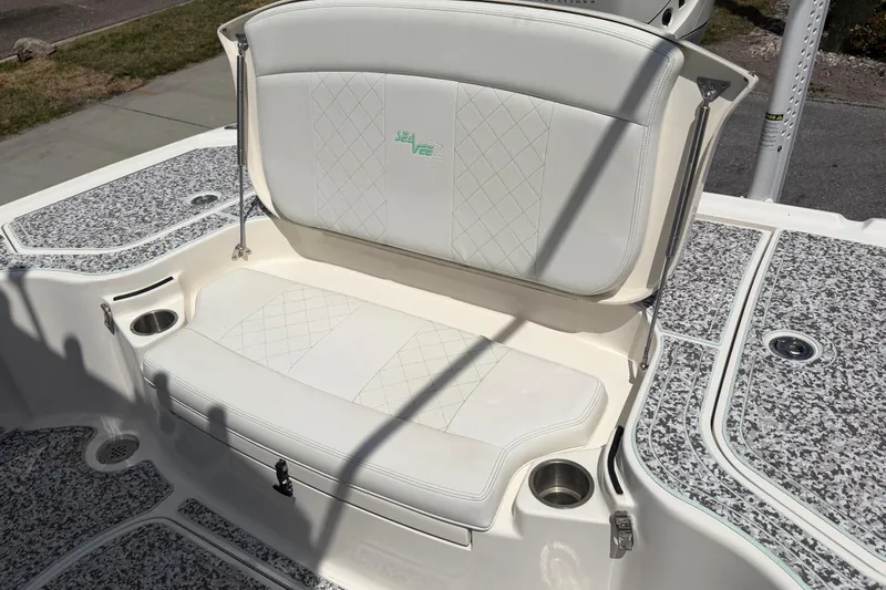 Slide: The Image of 2019 Sea Vee 270Z boat with white cushioned seating and cup holders. - 13