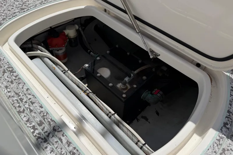 Slide: The Image of 2019 Sea Vee 270Z boat compartment with mechanical components and wiring. - 14