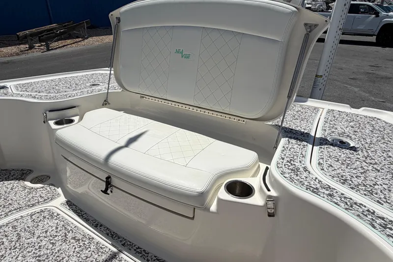Slide: The Image of 2019 Sea Vee 270Z boat interior with cushioned seating and cup holders. - 16