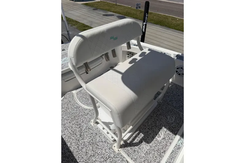 Slide: The Image of White cushioned seating on 2019 Sea Vee 270Z boat, featuring diamond stitching and rod holders. - 18