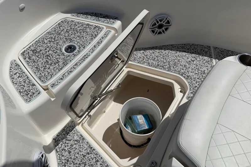 Slide: The Image of 2019 Sea Vee 270Z boat storage compartment with bucket and textured flooring. - 27