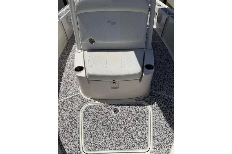 Slide: The Image of 2019 Sea Vee 270Z boat interior with cushioned seating and speckled flooring. - 28