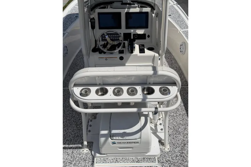 Slide: The Image of 2019 Sea Vee 270Z boat console with navigation screens and cup holders. - 32