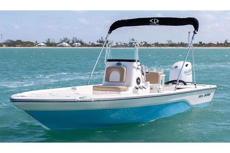The Image of Manufacturer Provided Image: 2025 Sea Born FX21 Bay boat on turquoise water with Suzuki engine. - 0