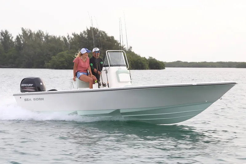 The Image of Manufacturer Provided Image: 2025 Sea Born FX22 Bay boat cruising on water with two passengers. - 0