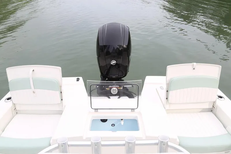 Slide: The Image of Manufacturer Provided Image: 2025 Sea Born FX22 Bay boat with outboard motor on calm water. - 11