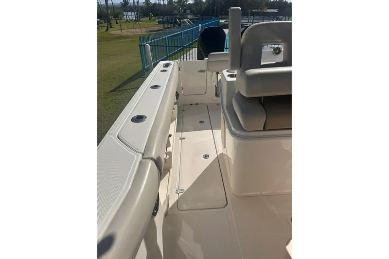 Slide: The Image of 2023 Boston Whaler 280 Outrage boat interior, showcasing seating and deck details. - 12