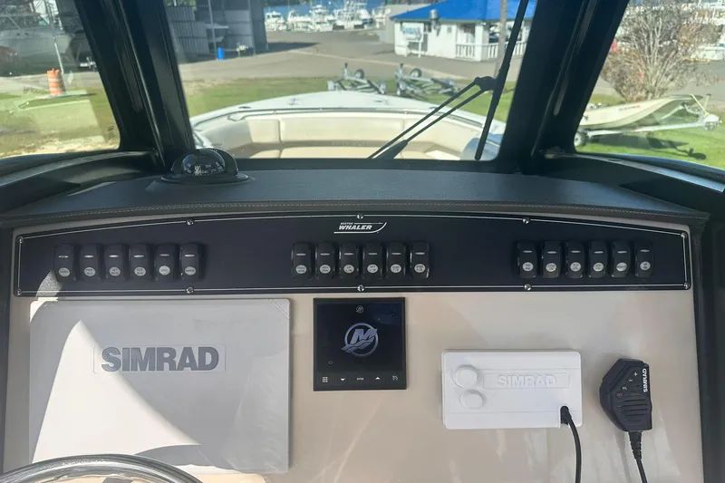 Slide: The Image of Control panel of 2023 Boston Whaler 280 Outrage boat with Simrad electronics. - 15