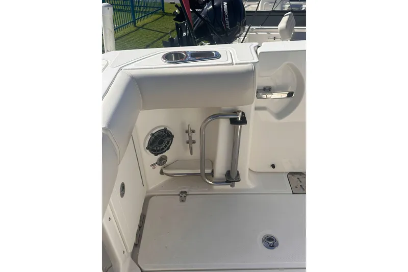 Slide: The Image of Boston Whaler 280 Outrage 2023 boat interior with stainless steel handle and speaker. - 6