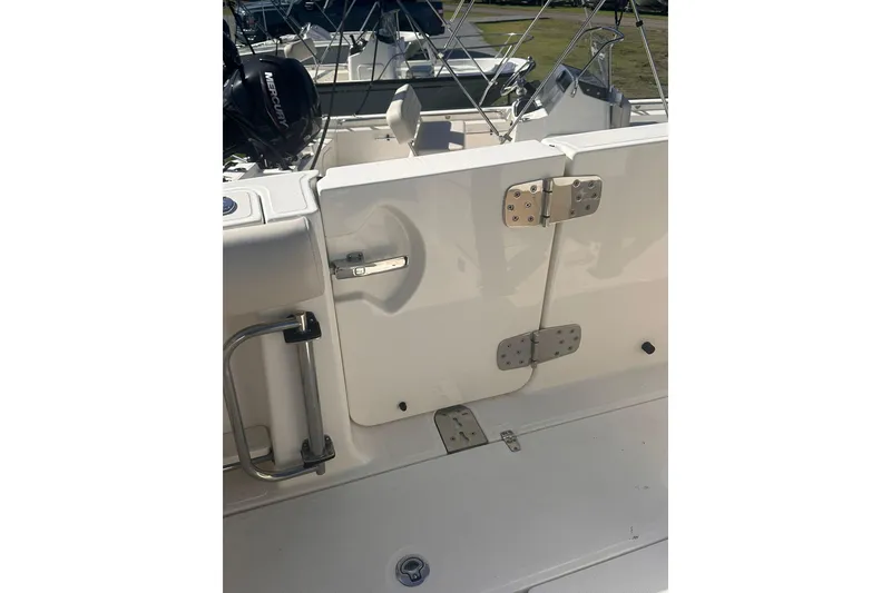 Slide: The Image of 2023 Boston Whaler 280 Outrage boat deck with stainless steel fittings. - 7