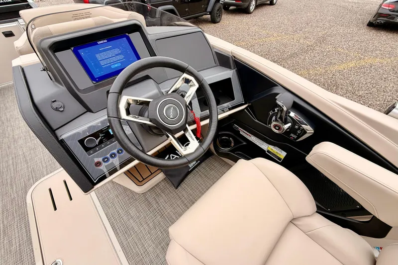 Slide: The Image of 2026 Tahoe Pontoon Cascade 25' VRL dashboard with modern steering and control panel. - 11