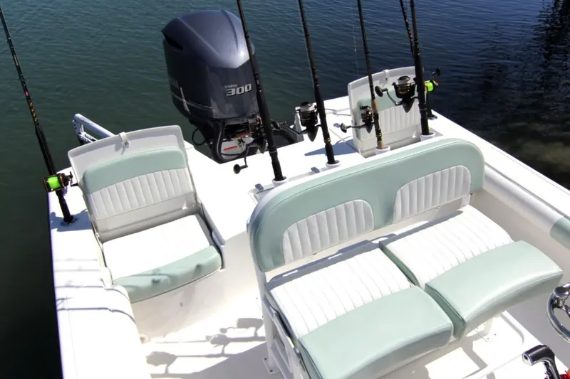 Slide: The Image of Manufacturer Provided Image: 2025 Sea Born FX24 Bay boat with fishing rods and seating on deck. - 5