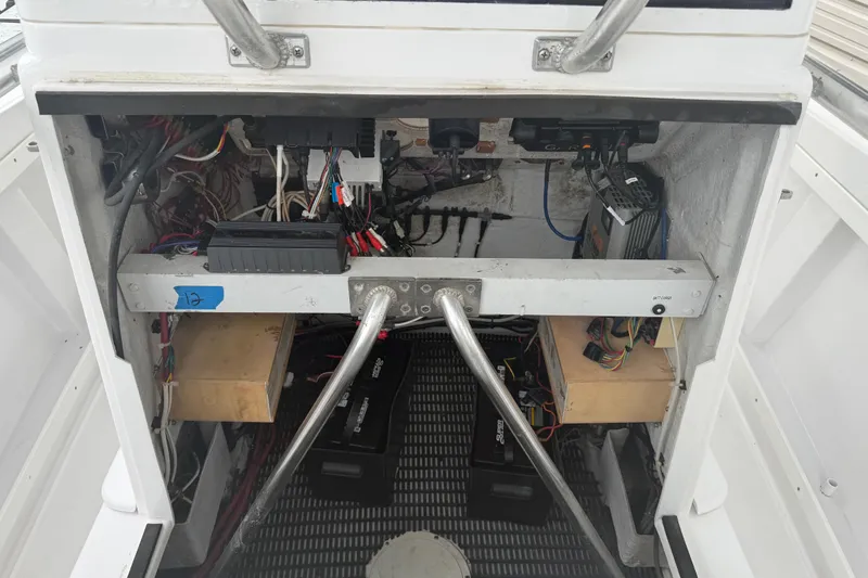 Slide: The Image of Interior view of a 1990 Mako 241 Center Console boat's wiring and battery compartment. - 18