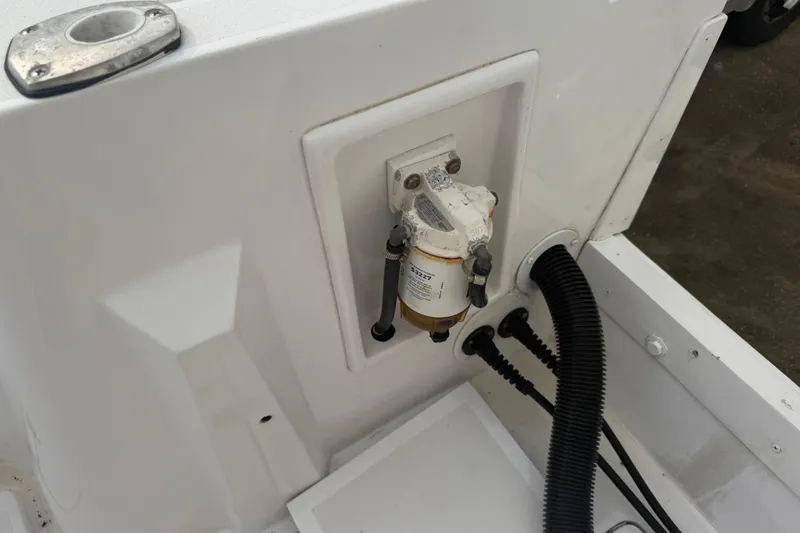 Slide: The Image of Fuel filter system on a 1990 Mako 241 Center Console boat. - 27