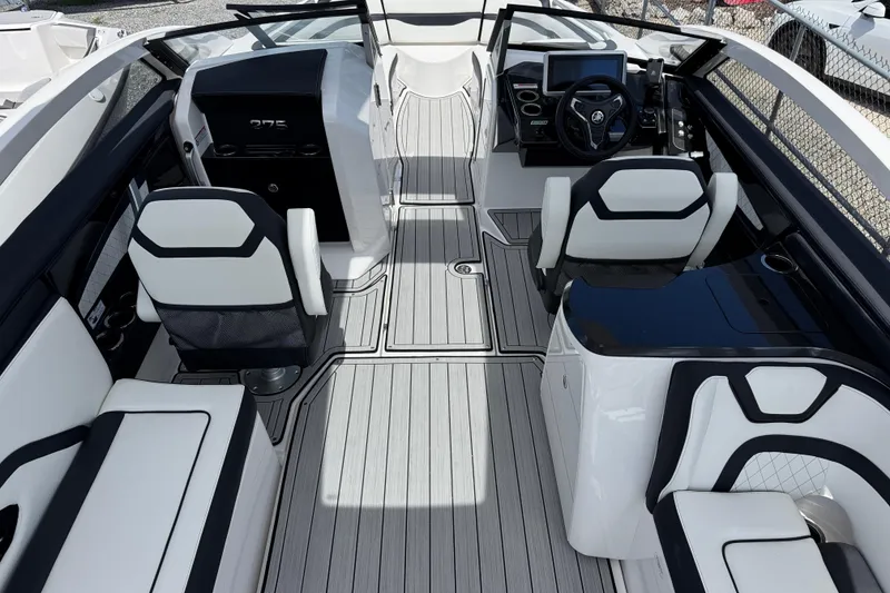 Slide: The Image of 2026 Yamaha Boats 275SD interior with sleek seating and modern dashboard design. - 11