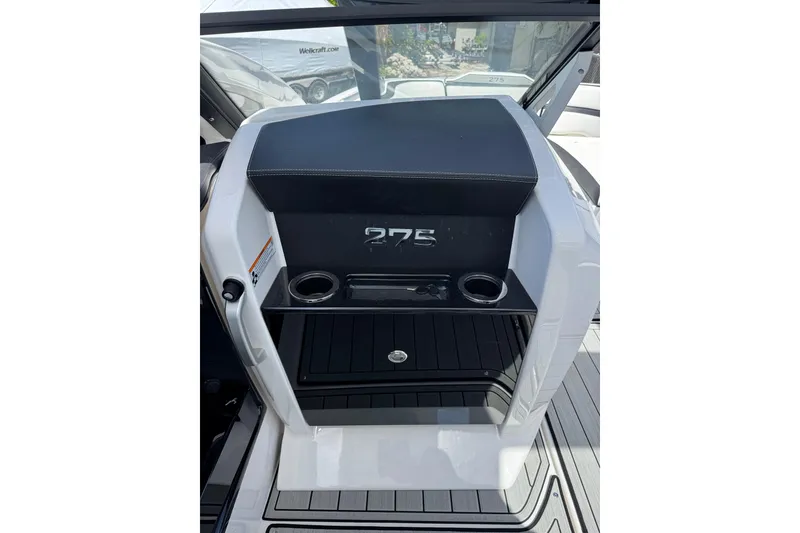 Slide: The Image of 2026 Yamaha Boats 275SD dashboard with cup holders and sleek design. - 17