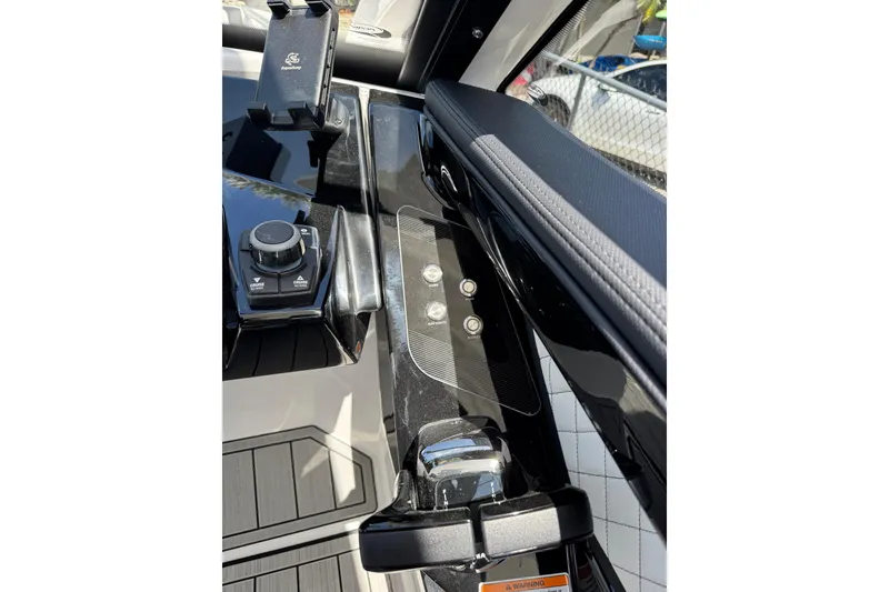 Slide: The Image of Interior view of 2026 Yamaha Boats 275SD dashboard with control panel and sleek design. - 21