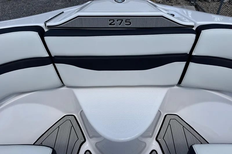 Slide: The Image of Interior seating of 2026 Yamaha Boats 275SD, featuring sleek white and black upholstery. - 26