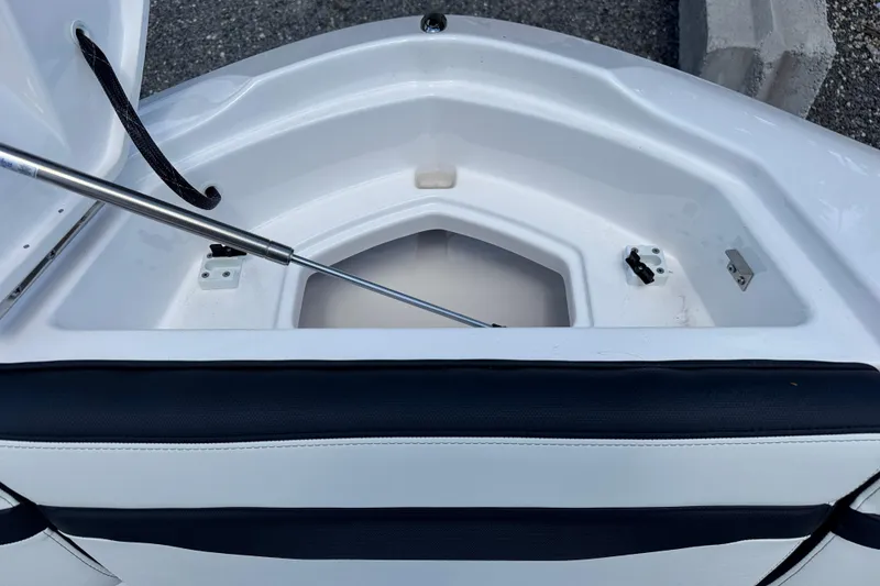 Slide: The Image of Open storage compartment on 2026 Yamaha Boats 275SD, featuring sleek design and durable materials. - 27