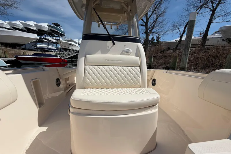 Slide: The Image of 2026 Grady-White Fisherman 216 boat interior with cushioned seating and sleek design. - 17