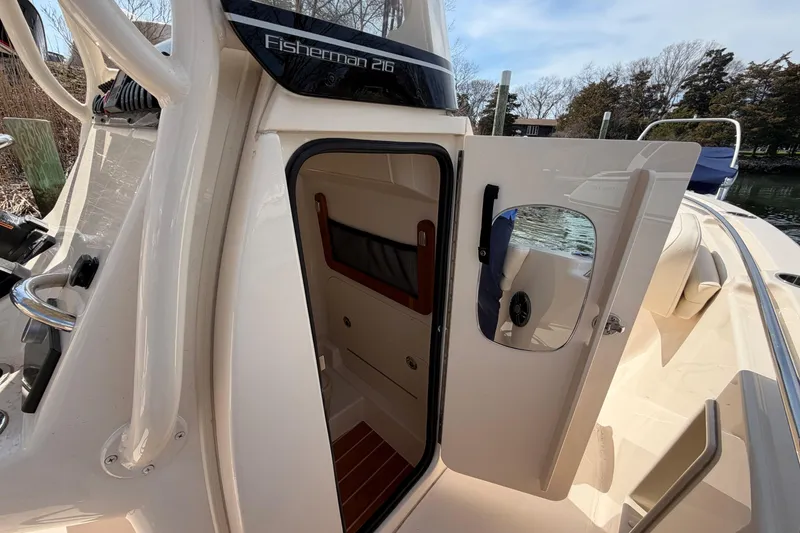 Slide: The Image of 2026 Grady-White Fisherman 216 boat interior with open cabin door. - 20