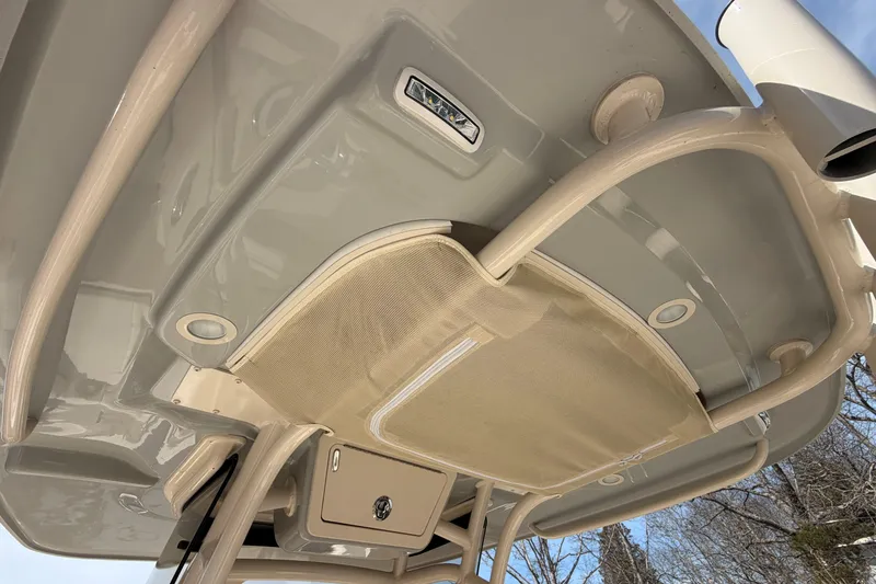 Slide: The Image of 2026 Grady-White Fisherman 216 boat interior, featuring overhead storage and lighting. - 23